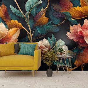 May include: A yellow armchair with a teal patterned pillow sits in front of a dark floral wallpaper with large, colorful flowers.