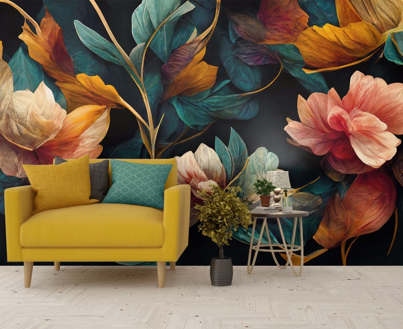 May include: A yellow armchair with a teal patterned pillow sits in front of a dark floral wallpaper with large, colorful flowers.