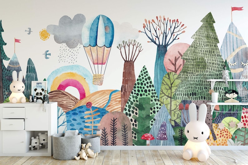 a child's room with a mural of a forest and hot air balloons