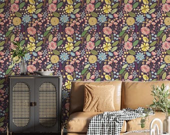 May include: A room with floral wallpaper in a dark purple hue. The wallpaper features a repeating pattern of colorful flowers and green leaves. A brown leather sofa, a black cabinet, and a patterned rug are in the room.