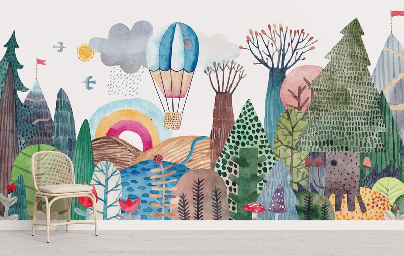 a wall mural of a forest with hot air balloons