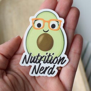 May include: A green avocado sticker with a smiling face wearing orange glasses and the text "Nutrition Nerd".