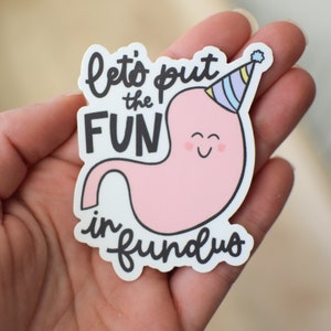 May include: A white sticker with a pink cartoon stomach wearing a party hat. The text on the sticker reads "Let's put the FUN in fundus".