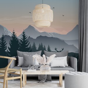 May include: A living room interior with a gray sofa and a wooden coffee table. The wall behind the sofa features a mountain landscape mural with a pink and blue sunset. A woven pendant light hangs from the ceiling.
