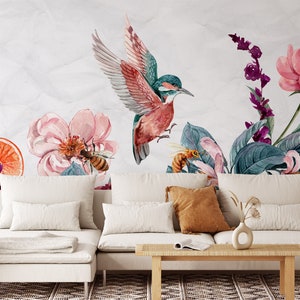 May include: Watercolor mural featuring a vibrant hummingbird with outstretched wings, surrounded by pink flowers, bees, and lush green leaves. The design includes a slice of orange and purple floral accents, creating a nature-inspired aesthetic.