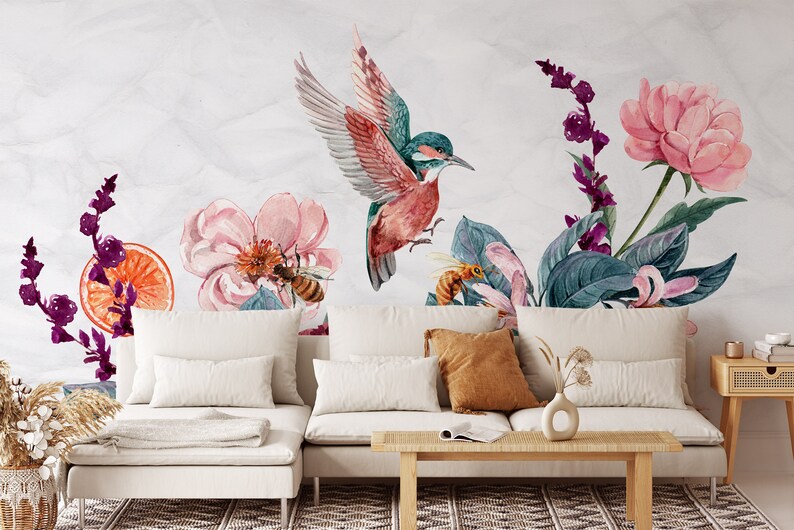 May include: Watercolor mural featuring a vibrant hummingbird with outstretched wings, surrounded by pink flowers, bees, and lush green leaves. The design includes a slice of orange and purple floral accents, creating a nature-inspired aesthetic.