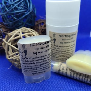 May include: Two white deodorant tubes with brown labels that read "NO Mosquitoes Buzzzzz off! Bug Repellent Stick" and "ADirtyHoe.com".