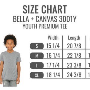 May include: Size chart for Bella + Canvas 3001Y Youth Premium Tee. The chart shows the width and length of the tee in inches for sizes S, M, L, and XL. The chart also shows the corresponding age range for each size.