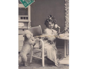 Vintage postcard ∙ Cute little girl and her dog