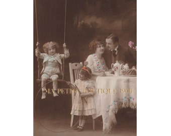 Vintage postcard ∙ Couple and children ∙ Child on swing