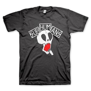 May include: A dark gray t-shirt with a white skull graphic and the text "Subhumans" in white letters.