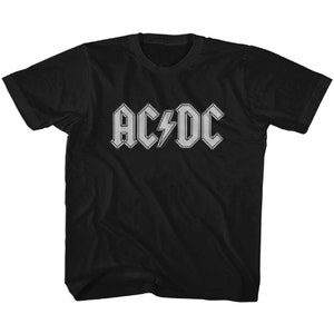 May include: Black t-shirt featuring the band AC/DC's logo in a silver, textured design. The logo includes the band's name and a lightning bolt. The shirt is a classic crew neck style.