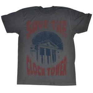 May include: A dark gray t-shirt with a distressed red and blue print that says "Save the Clock Tower". The print features a building with a clock tower.