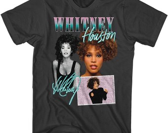 May include: Black t-shirt with a vintage-style graphic of Whitney Houston. The graphic features three images of Whitney Houston, with the text "Whitney Houston" in pink and blue lettering.