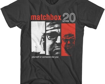 May include: Black t-shirt with a white and red graphic of the band Matchbox 20. The graphic features the band's name in red and white text and a black and white image of two men's faces. The text below the graphic reads "yourself or someone like you".
