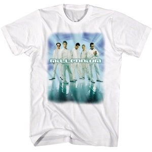 May include: White t-shirt with a faded blue and green graphic of a band called "Millennium". The band members are wearing white clothing and are standing in a row.