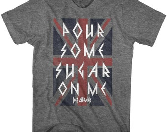 May include: A heather grey t-shirt with a vintage-style print of the Union Jack flag. The text "Pour Some Sugar On Me" is printed in white letters over the flag, with "Def Leppard" printed below in smaller letters.