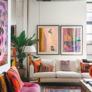 May include: A modern living room with a white sofa, colorful throw pillows, and framed artwork. A large potted plant and a patterned rug add to the room's decor. The artwork includes a painting of a shower.