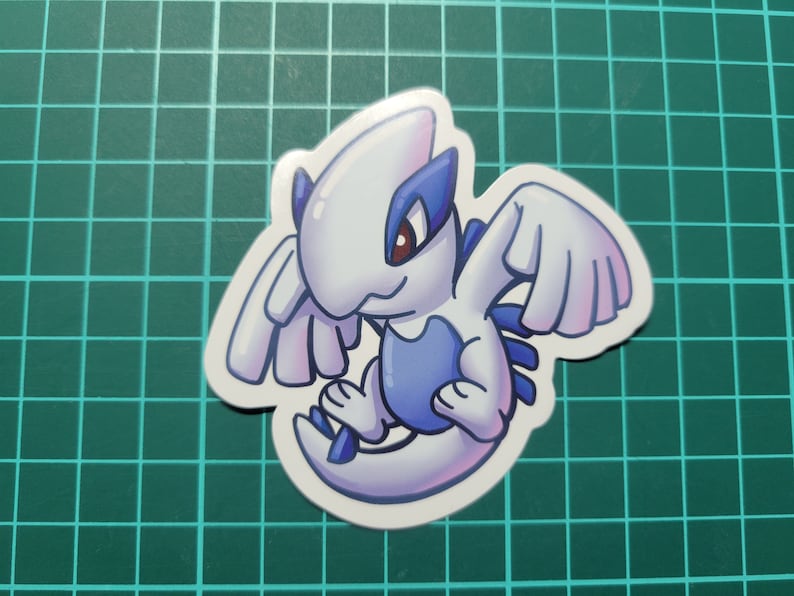 May include: A white and blue cartoon sticker of a mythical creature with wings. The creature has a blue body and white wings. The creature is looking to the left.
