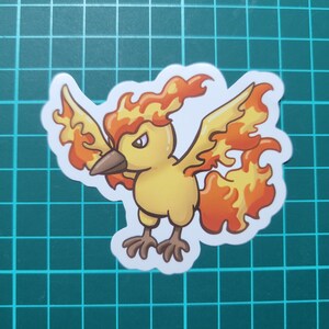 May include: A yellow and orange cartoon bird with flames for feathers. The bird has a fierce expression and is facing the left side of the image.