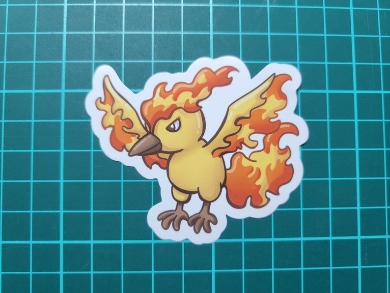 May include: A yellow and orange cartoon bird with flames for feathers. The bird has a fierce expression and is facing the left side of the image.