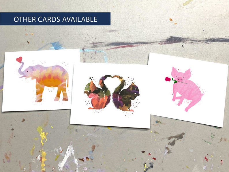 May include: Three watercolor art cards featuring animal illustrations. One card shows a pink elephant with a heart, another depicts two squirrels forming a heart shape, and the third shows a pink pig with a rose. The text "OTHER CARDS AVAILABLE" is at the top.