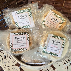 May include: Four exfoliating hand and body soaps with natural shea butter and loofah. The soaps are packaged in clear plastic bags and labeled with the brand name "Meg's Leafy Luxuries" and the scent of each soap: Eucalyptus Mint, Vanilla Pomegranate, Coconut, and Peach Mango.
