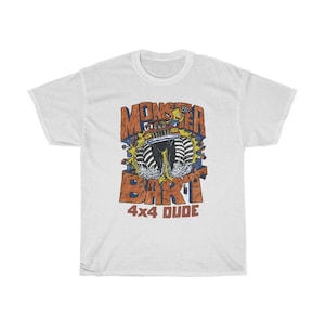 May include: White t-shirt featuring a graphic of a monster truck with the text "Monster Bart 4x4 Dude" printed on it.