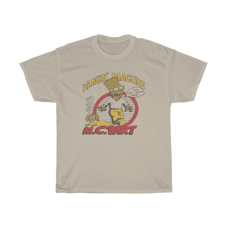 May include: A beige t-shirt featuring a cartoon image of Bart Simpson as a rapper. The image is within a red circle with the text "Dancin' Machine" above and "M.C. Bart" below. The text inside the circle reads "You can't touch this!"