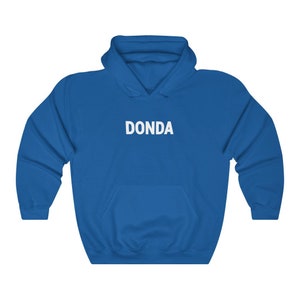 May include: A royal blue hooded sweatshirt with the word "DONDA" printed in white on the front.