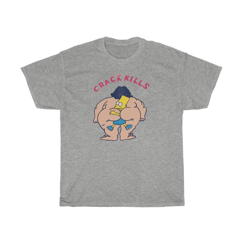 May include: A grey t-shirt featuring a cartoon image of a yellow character wearing a blue shirt and black hair. The text "CRACK KILLS" is printed in pink above the image.