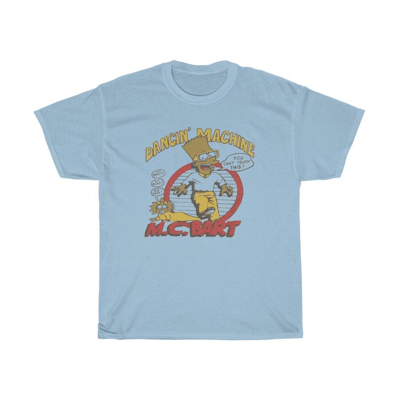 May include: Light blue t-shirt featuring a cartoon image of Bart Simpson as a rapper. The image includes the text "Dancin' Machine" and "MC. Bart".