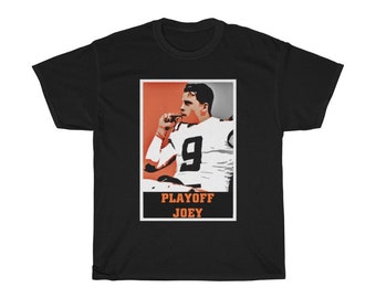 May include: Black t-shirt with a graphic of a football player wearing a white jersey with the number 9. The graphic is in a red and orange frame with the text "PLAYOFF JOEY".