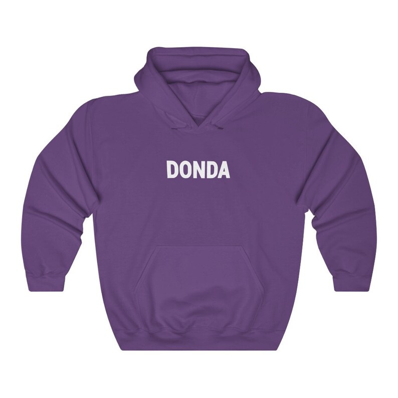 May include: Purple hooded sweatshirt with the word "DONDA" printed in white on the front.