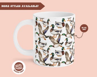 May include: White ceramic mug with a pattern of colorful ducks. The mug has a large handle and says "20 oz. BIG!" on the side.