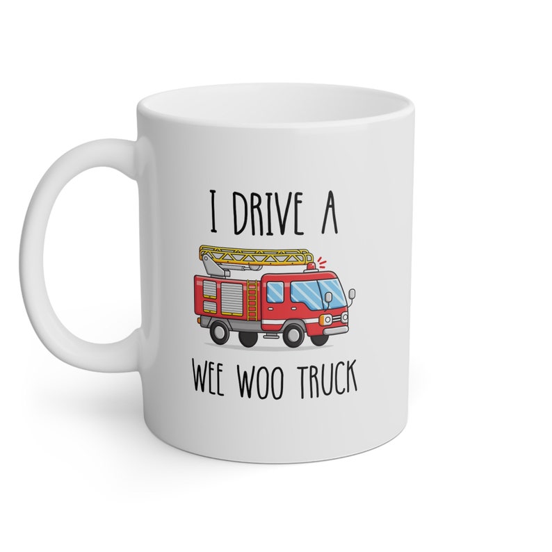 May include: White ceramic mug with a red fire truck illustration and the text "I drive a wee woo truck".