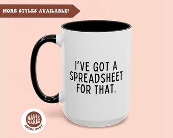 May include: White ceramic coffee mug with a black handle and black rim. The mug has black text that reads "I've got a spreadsheet for that."