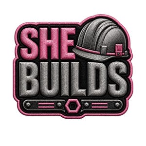May include: A graphic emblem with the words "SHE BUILDS" in pink and gray, accompanied by a gray construction helmet. The design is outlined in black and pink, with a textured appearance, suggesting a patch or sticker.