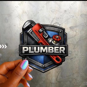 May include: A plumber's emblem featuring a red pipe wrench and a valve on a shield-shaped design. The word "PLUMBER" is displayed in bold, white letters on a black banner. The background is a textured gray.