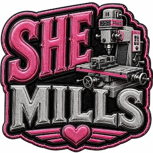 May include: A patch featuring the text SHE MILLS in bold, embossed lettering. The word SHE is in bright pink, and MILLS is in metallic silver. A detailed illustration of a milling machine sits beside the text, with a pink heart and wings at the bottom.
