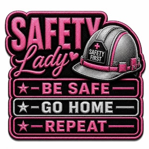 May include: A rectangular embroidered patch with a black background and pink border. It features a silver hard hat with a pink stripe and the text SAFETY FIRST. The text reads SAFETY Lady, BE SAFE, GO HOME, REPEAT, with star icons and a heart.