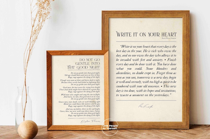 May include: Two framed prints with inspirational quotes. The print on the left is a poem by Dylan Thomas titled "Do Not Go Gentle Into That Good Night". The print on the right is a quote by Rabindranath Tagore titled "Write It On Your Heart".