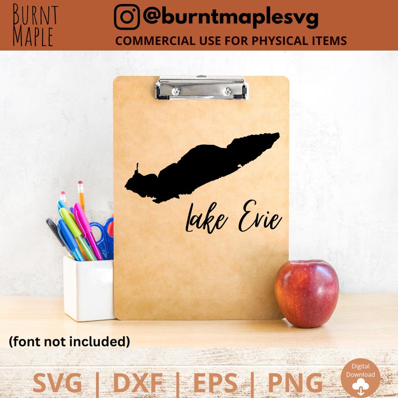 Puede incluir: Un portapapeles marr&oacute;n con una silueta negra del lago Evie y el texto "Lake Evie" en letra cursiva negra. El texto "@burntmaplesvg" y "COMMERCIAL USE FOR PHYSICAL ITEMS" tambi&eacute;n son visibles en el portapapeles.