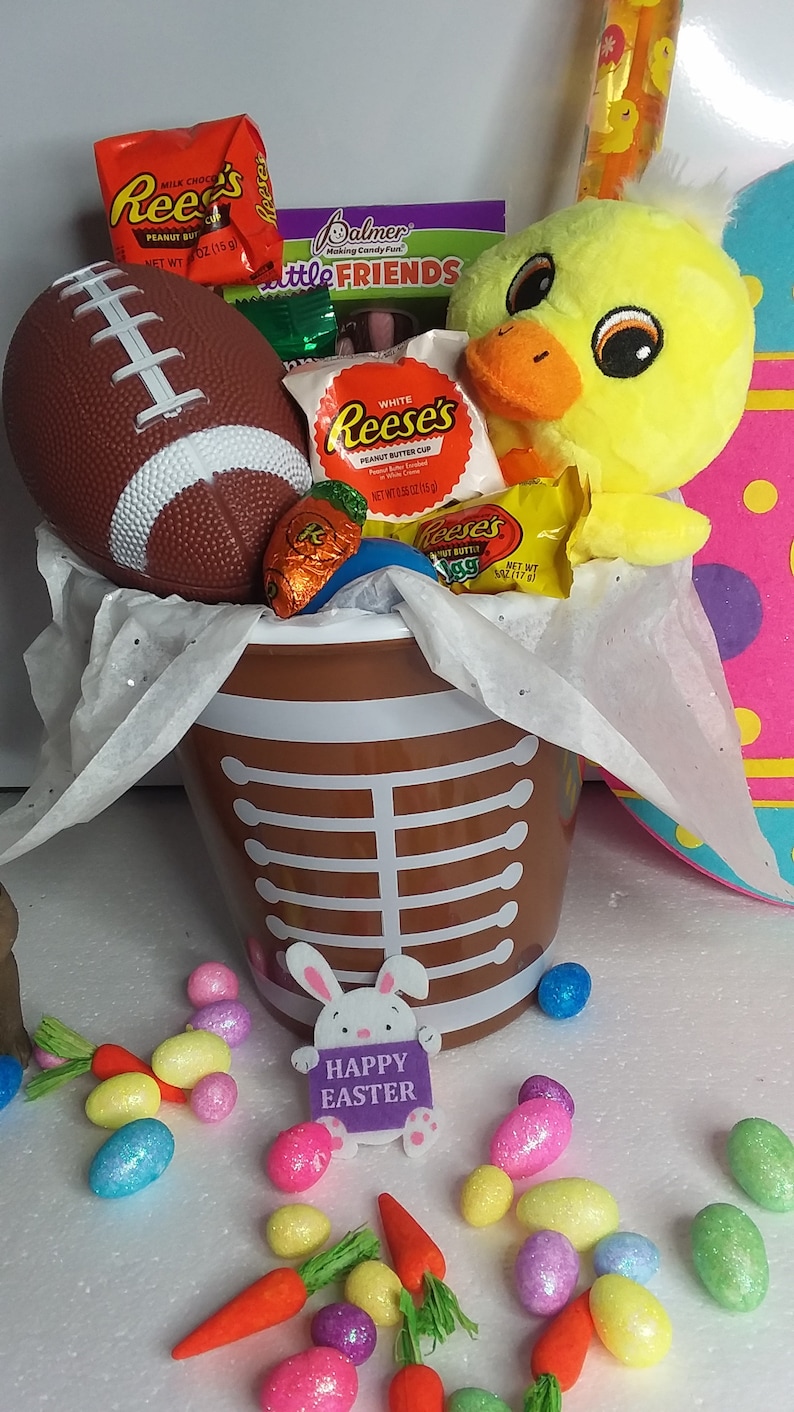 Kids boys football happy Easter basket filled with goodies