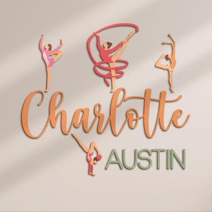 May include: Wooden wall art featuring stylized gymnast figures in various poses, with a ribbon. The name "Charlotte" is written in orange script, and "Austin" in green block letters. The figures are in shades of pink, peach, and brown.