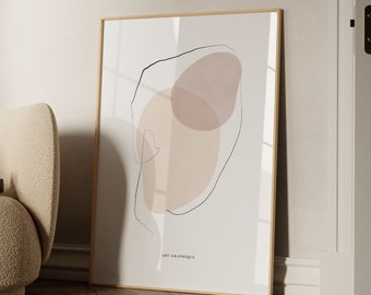 May include: Abstract art print with two overlapping beige and pink watercolor shapes enclosed in a black line drawing. The print has the text "Art Graphique" and "By Gabis" at the bottom.
