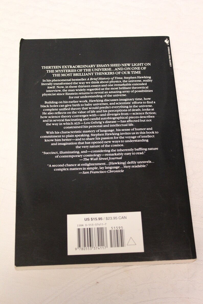 May include: Black and white book cover with the title "Black Holes and Baby Universes and Other Essays" by Stephen Hawking. The back cover features a blurb about the book and includes the price of &pound;15.95.