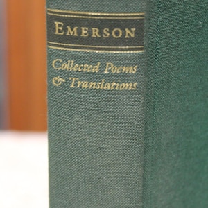 May include: A green hardcover book with gold lettering on the spine. The title is "EMERSON Collected Poems & Translations".