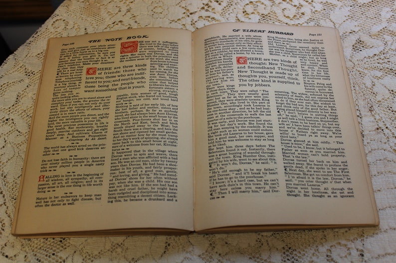 May include: An open book with the title "The Note Book of Elbert Hubbard" on the cover. The book is open to pages 128 and 129. The text on the pages discusses the importance of friends and the different types of friends. The text also discusses the concept of "New Thought" and "Secondhand Thought".