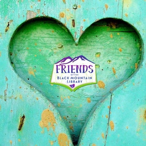 May include: A teal blue wooden heart-shaped cutout with a white sticker that says "Friends of the Black Mountain Library" in a green and white logo.